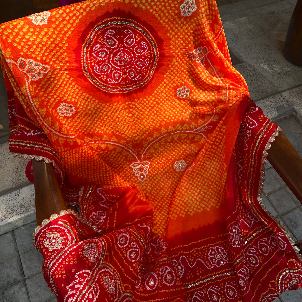 
                      
                        Orange Red Gaji Silk Bandhani Dupatta with Gota Patti
                      
                    