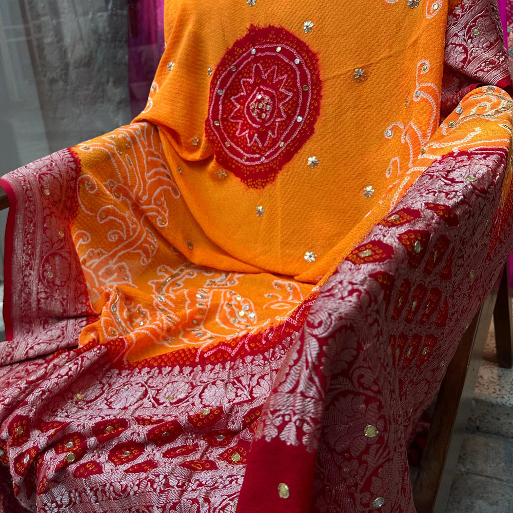 
                      
                        Peacock Peeliya — Orange Red Banarasi Bandhani with Gota Patti
                      
                    