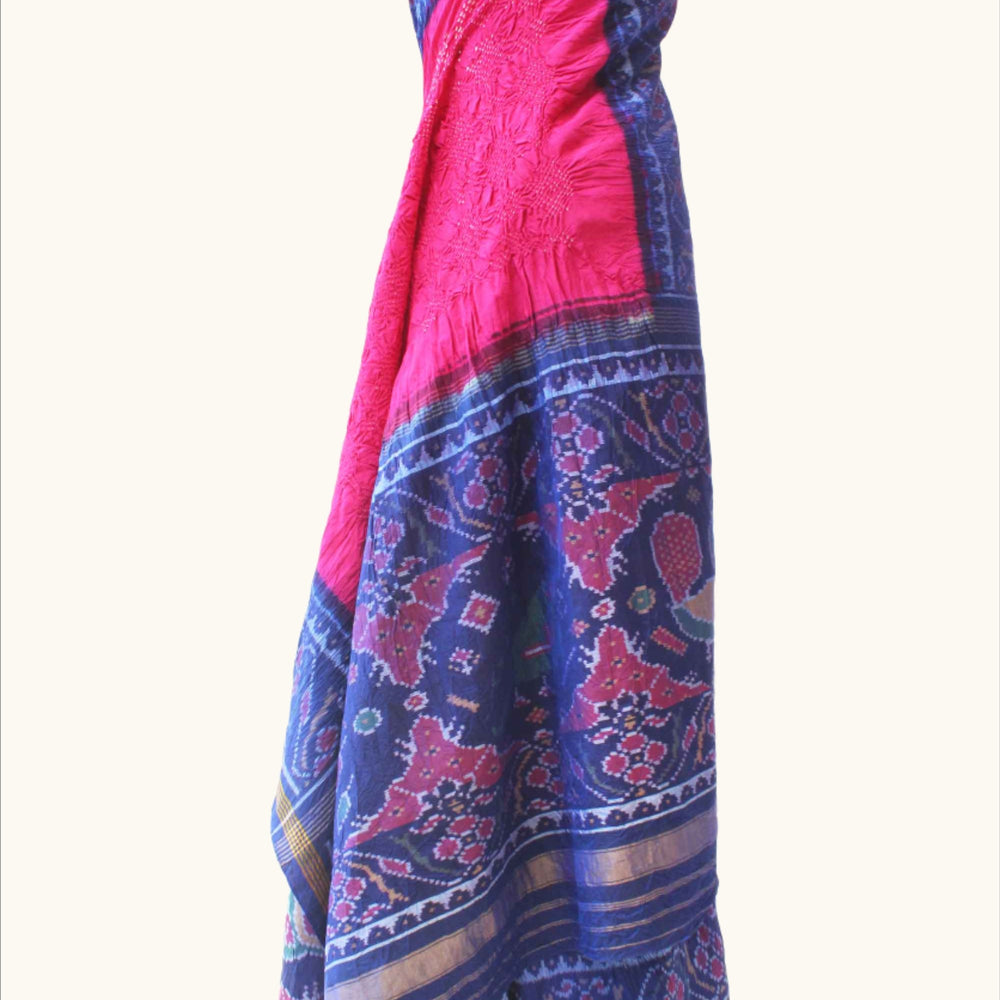 
                      
                        Pink and Blue Patola Border Saree with Bandhani
                      
                    