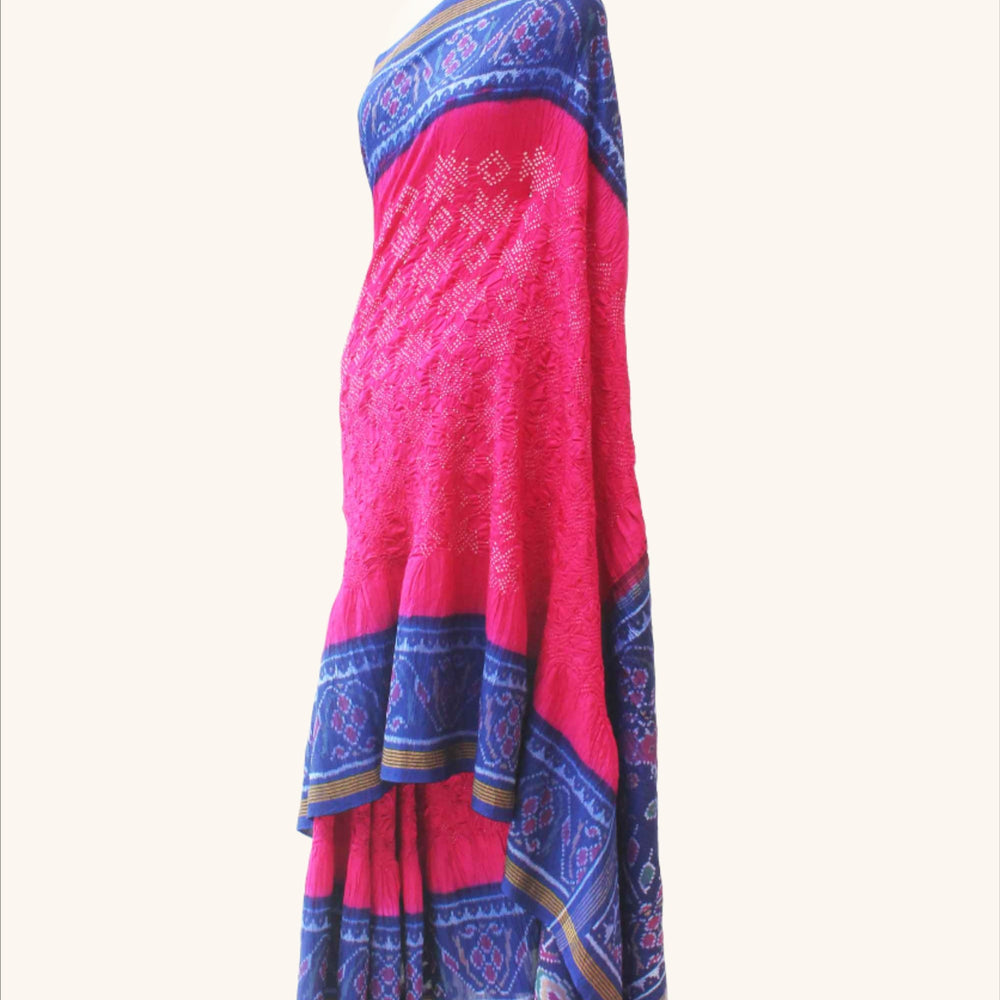 
                      
                        Pink and Blue Patola Border Saree with Bandhani
                      
                    