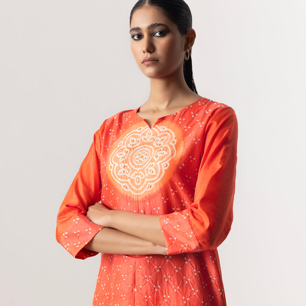 
                      
                        Circle Bandhani Suit Set By Naina Jain-Orange
                      
                    