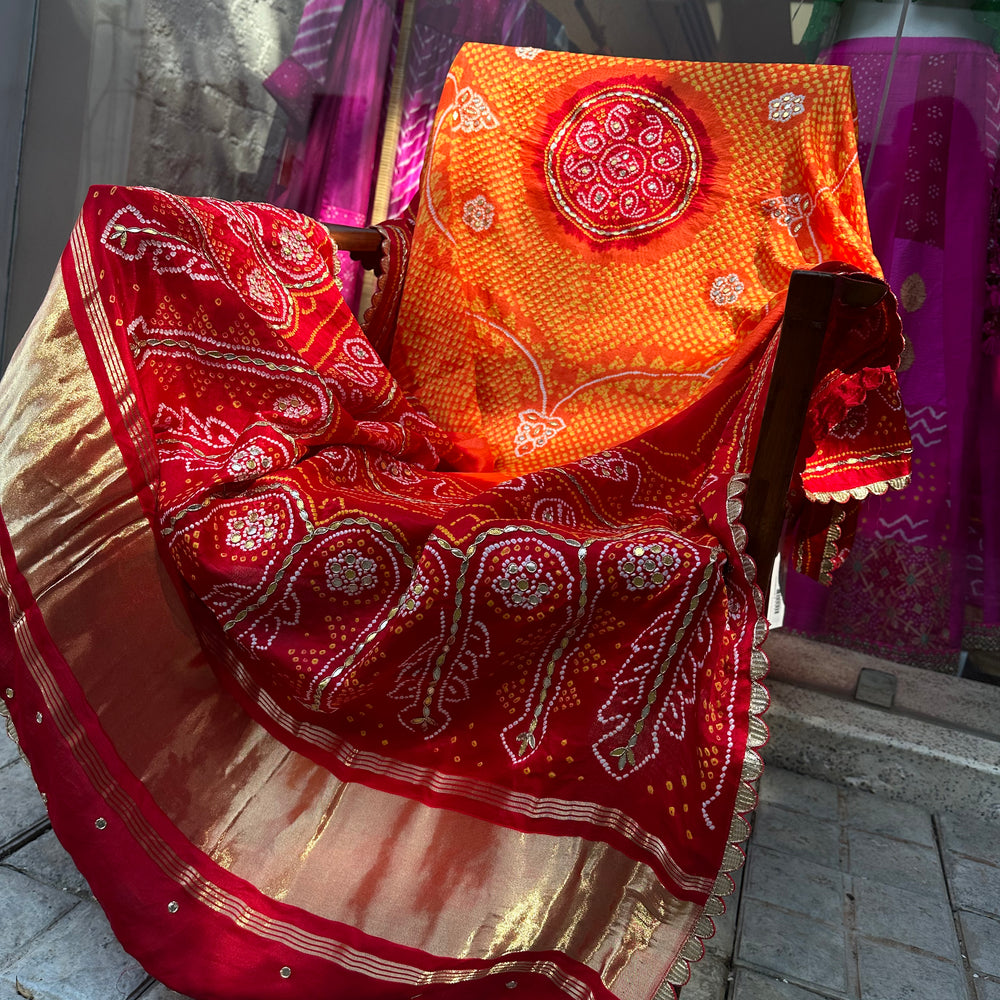 
                      
                        Orange Red Gaji Silk Bandhani Dupatta with Gota Patti
                      
                    