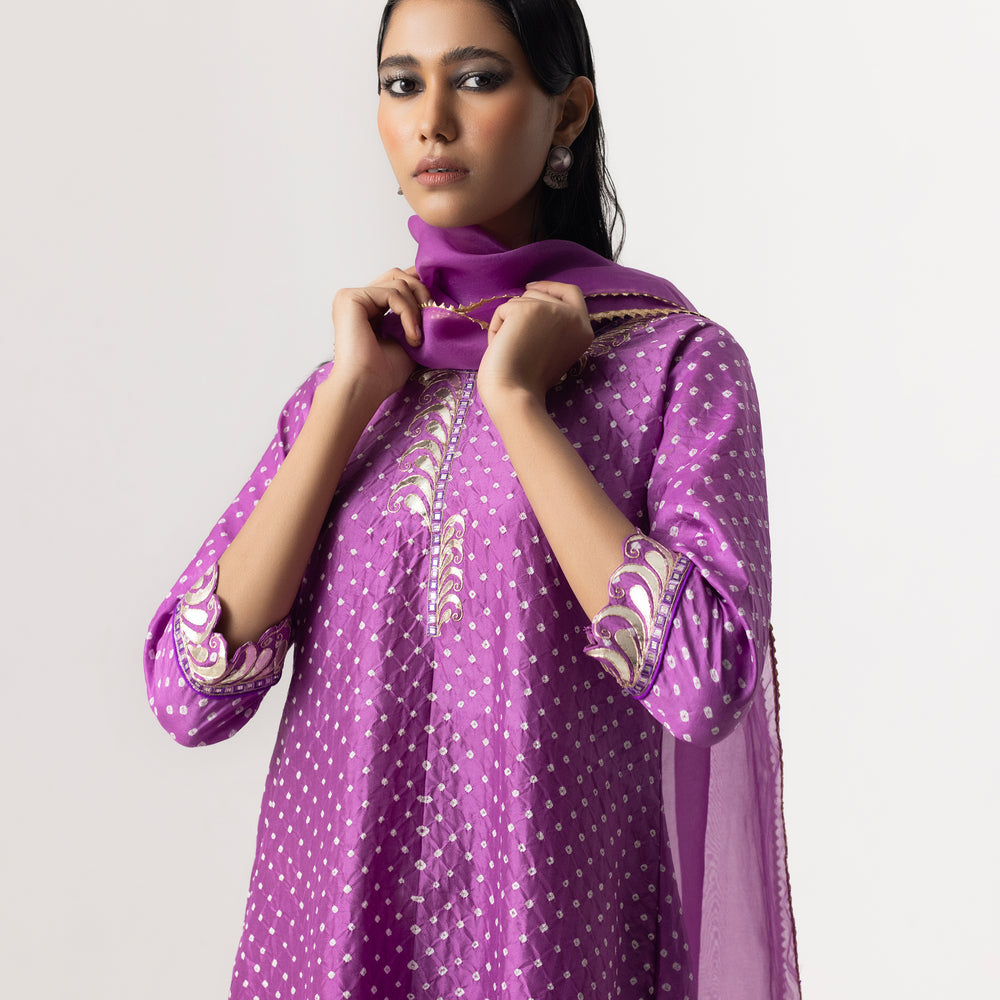 
                      
                        Gota Bandhani Suit Set By Naina Jain-Lavender
                      
                    