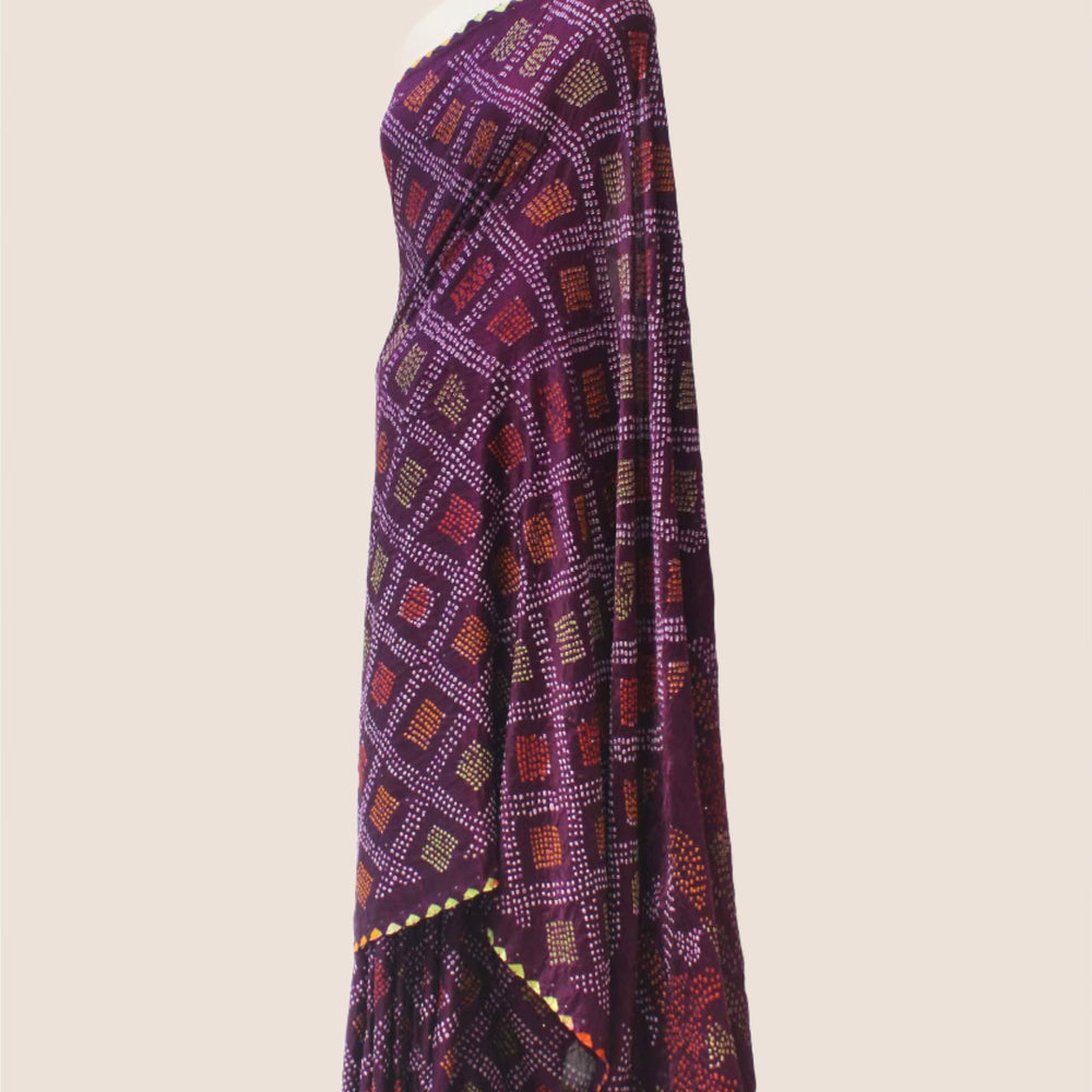 
                      
                        Multicoloured Bandhani on Gaji Silk Saree - Plum
                      
                    