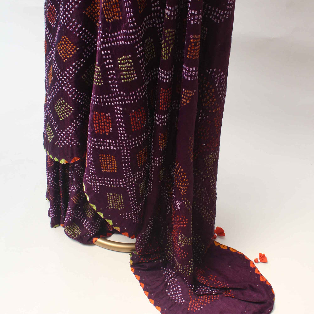 
                      
                        Multicoloured Bandhani on Gaji Silk Saree - Plum
                      
                    