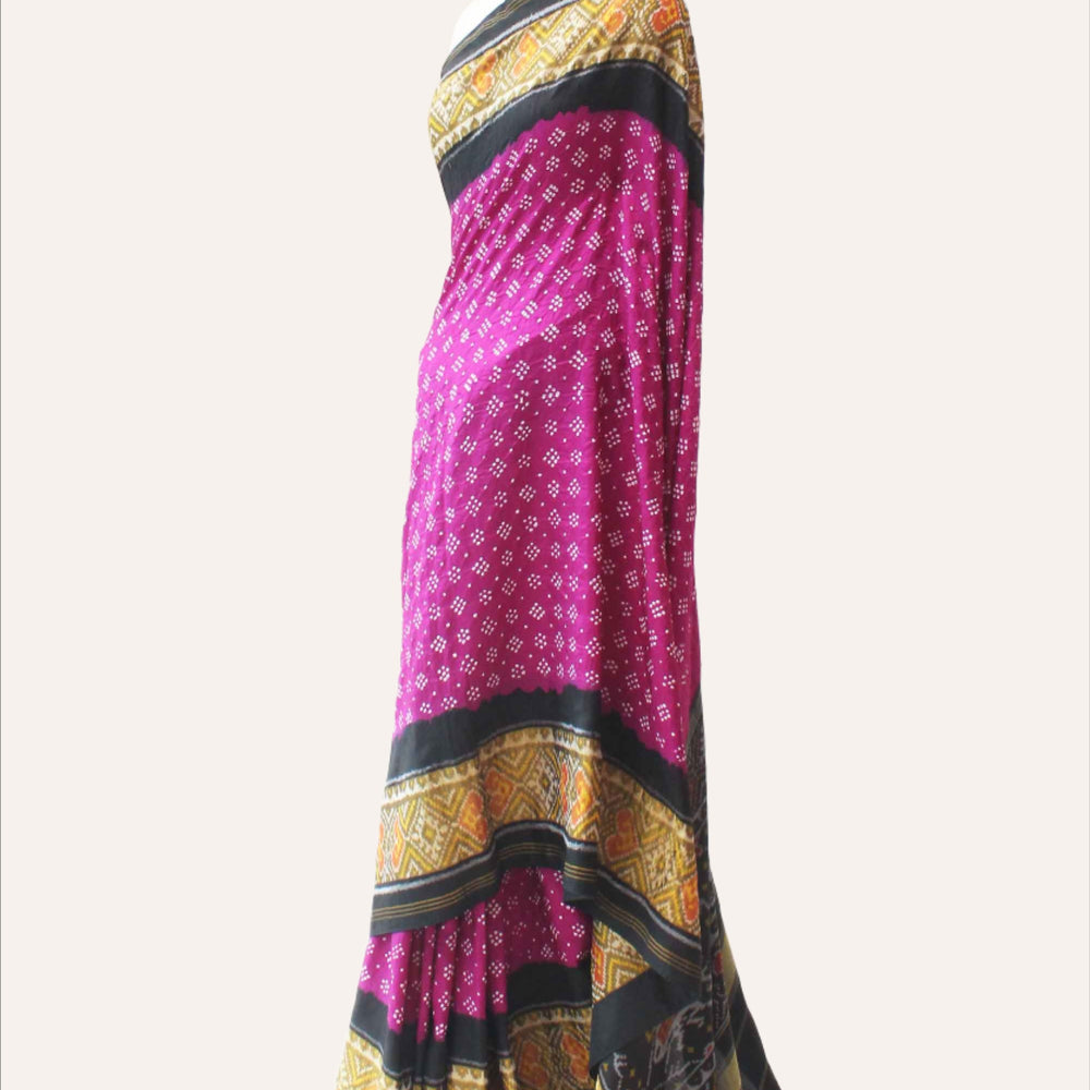 
                      
                        Magenta and Black Patola Border Saree with Bandhani
                      
                    