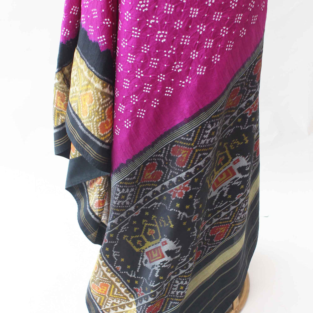 
                      
                        Magenta and Black Patola Border Saree with Bandhani
                      
                    