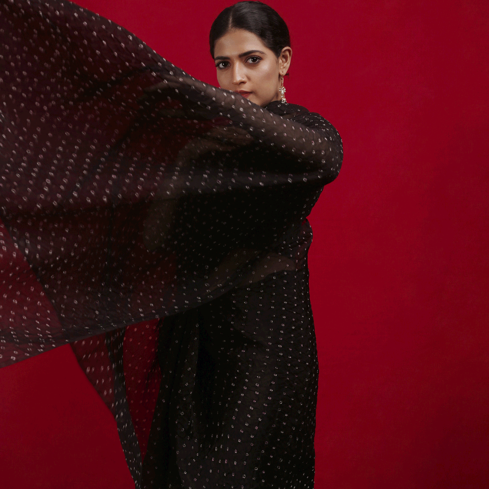 
                      
                        Bandhani on Pure Organza Saree in a Jet Black
                      
                    