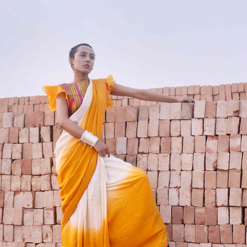 
                      
                        Haldi Yellow and Off White Shaded Silk Saree
                      
                    