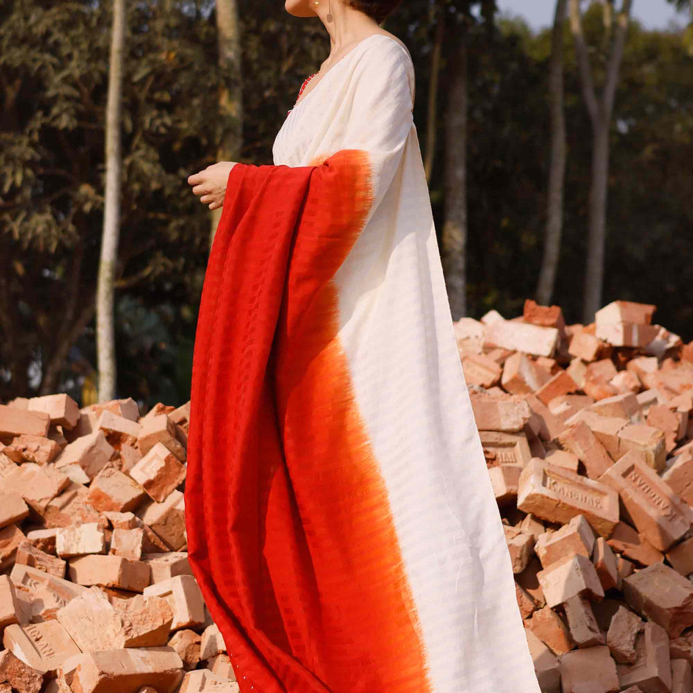 
                      
                        Brick Red Off White Shaded Silk Cotton Saree
                      
                    