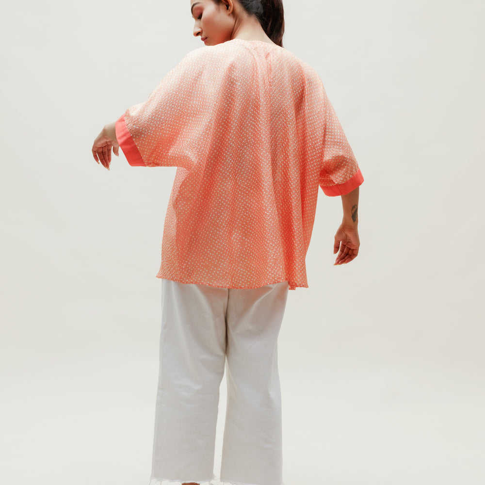 
                      
                        Peach Bandhani on Silk Shirt
                      
                    