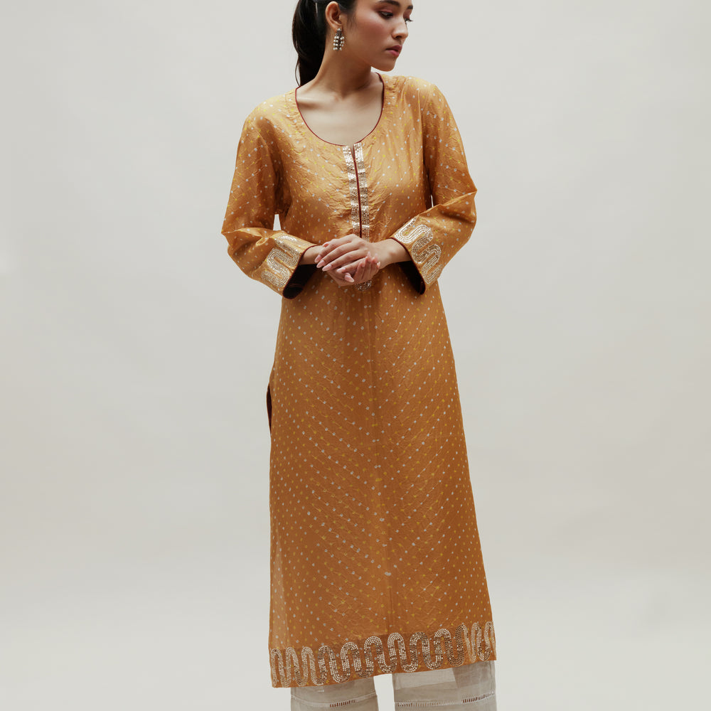 
                      
                        Beige Bandhani on Silk Kurta with Mirror Work
                      
                    