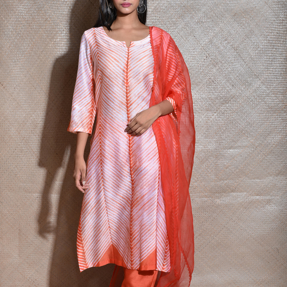 
                      
                        Arashi Chanderi Suit Set in Orange
                      
                    