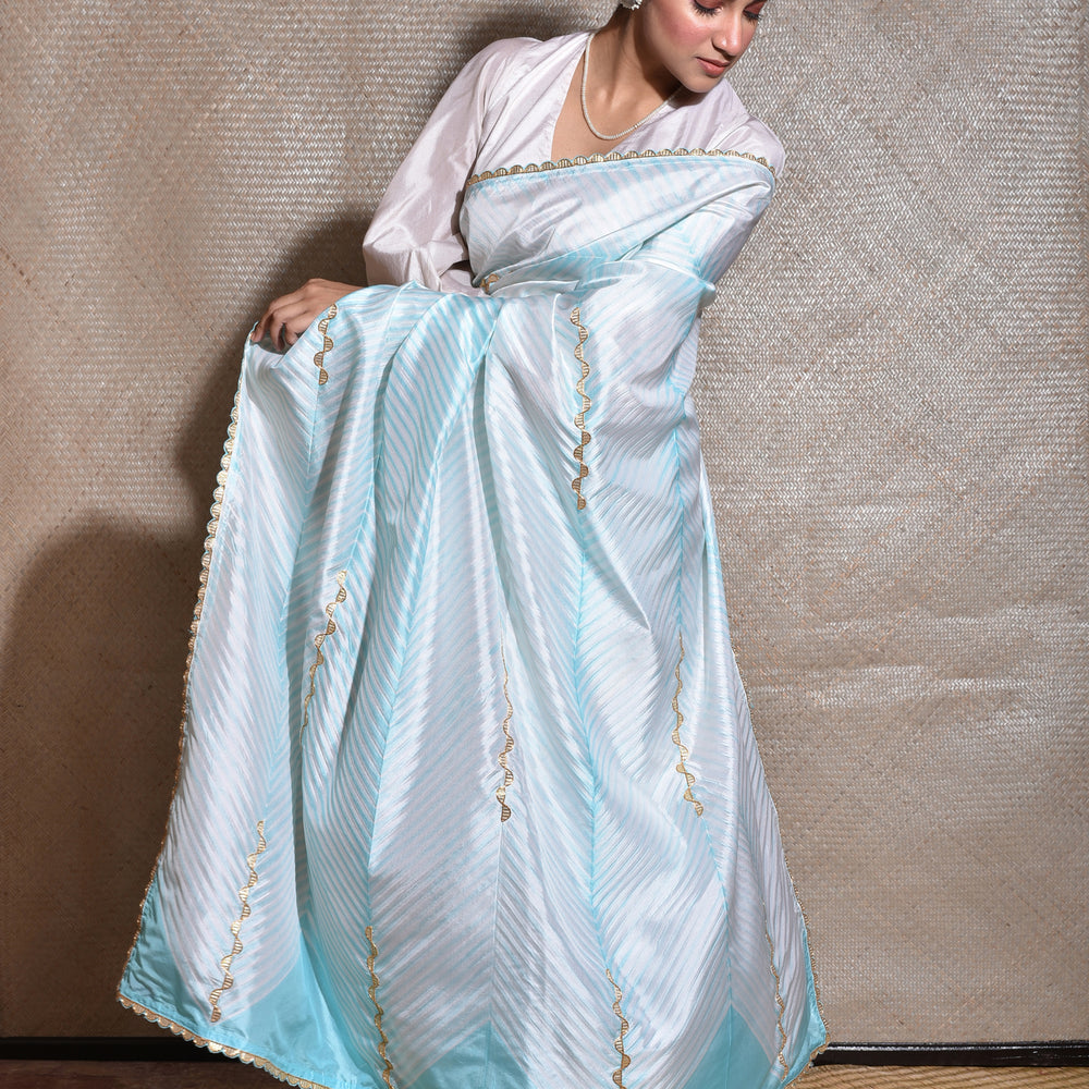 
                      
                        Arashi on Pure Silk Saree with Gota Patti - Sky Blue
                      
                    