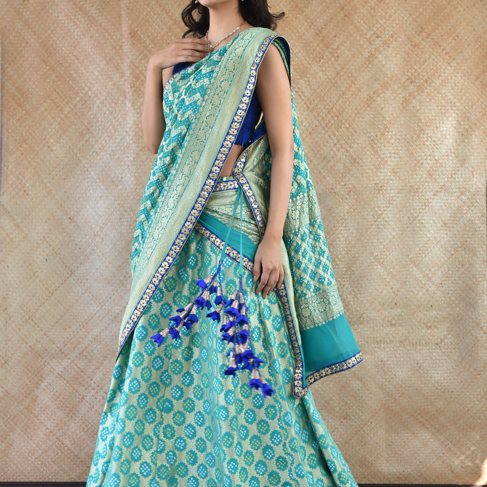 
                      
                        Banarasi Bandhani Lehenga Set In Sea Green
                      
                    