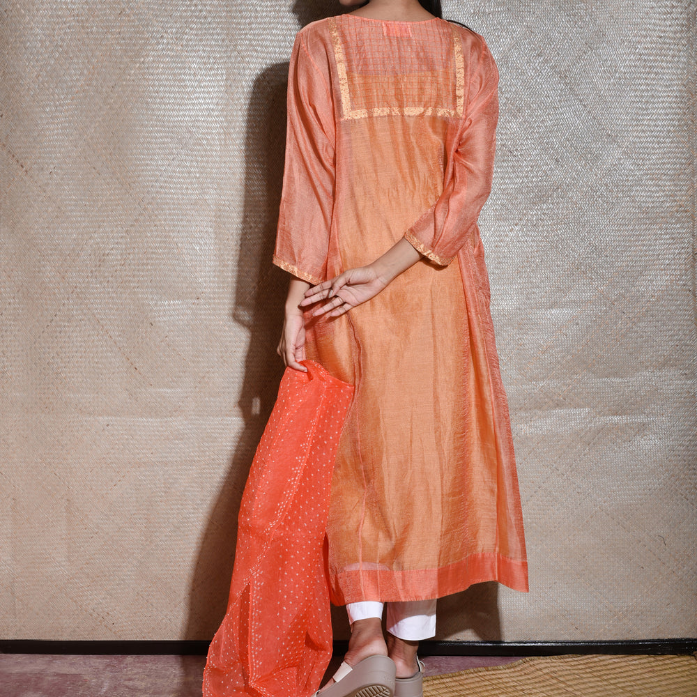 
                      
                        Tissue Chanderi Kurta Set With Bandhani on Organza Dupatta -Orange.
                      
                    