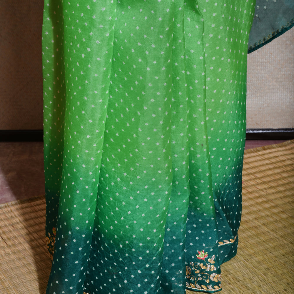 
                      
                        Bandhani on Organza Saree with Gota Patti - Green Shaded
                      
                    