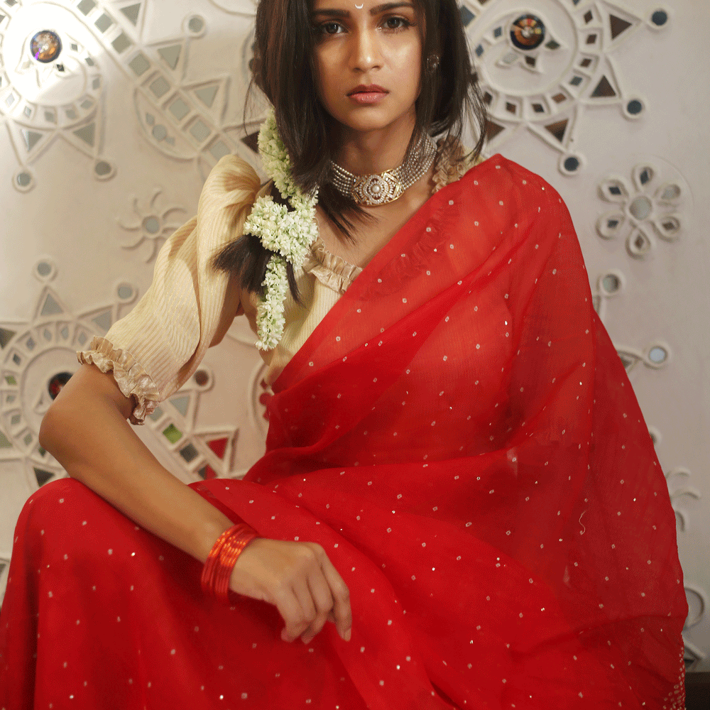 
                      
                        Bandhani on Organza Saree in a Bright Red
                      
                    