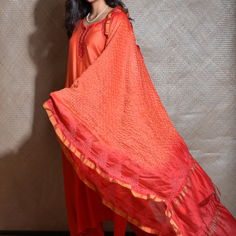 
                      
                        Chanderi Suit Set with Bandhani Dupatta -Red And Orange
                      
                    