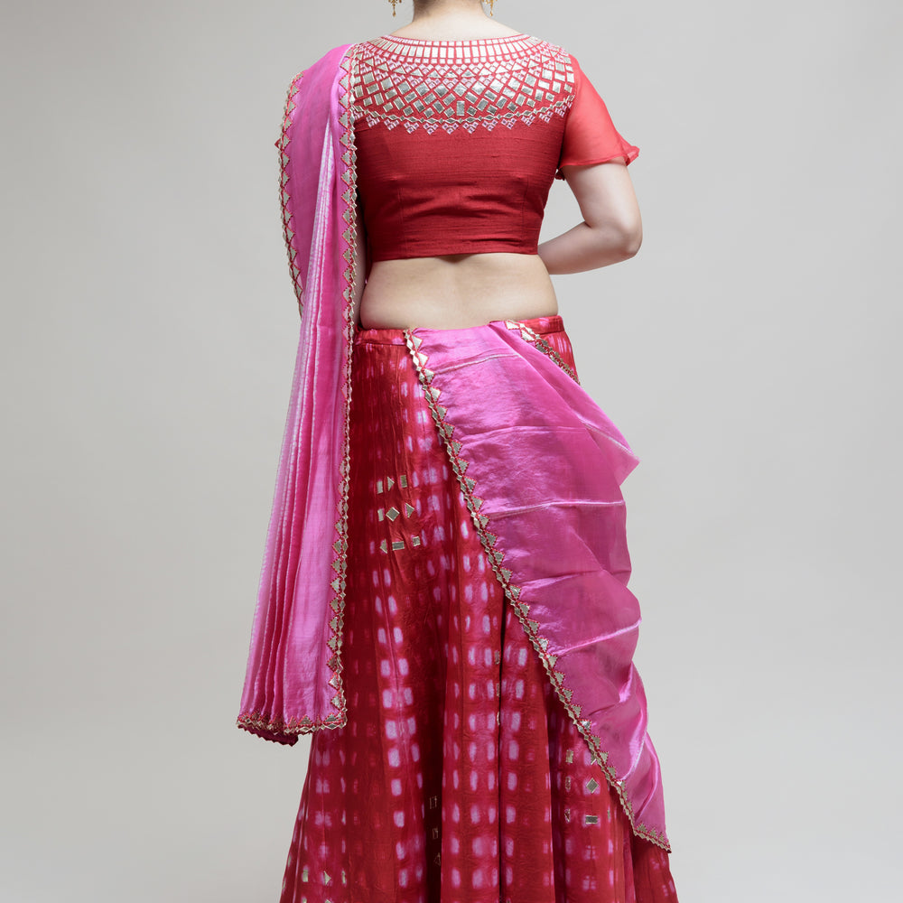 
                      
                        Clamp Dye Organza Gota Patti Lehenga Set - Red
                      
                    