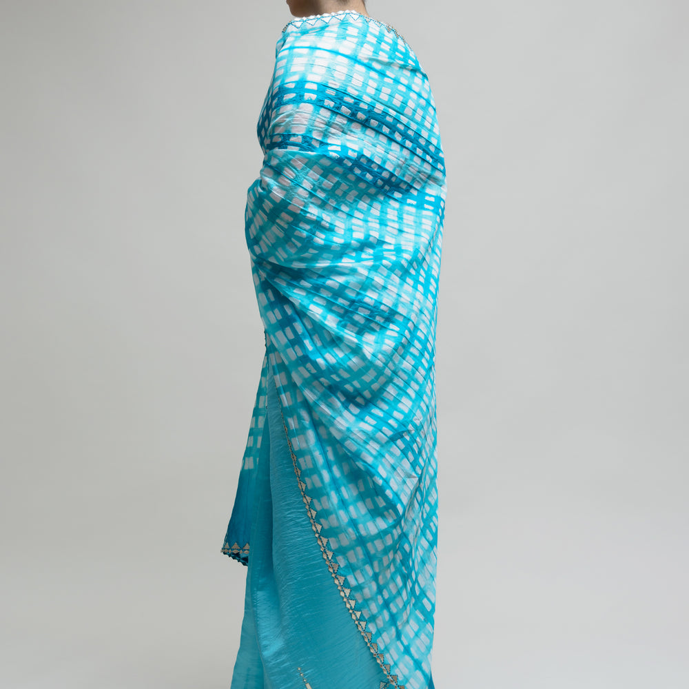 
                      
                        Clamp Dyed Chanderi Saree with Gota Patti - Blue
                      
                    