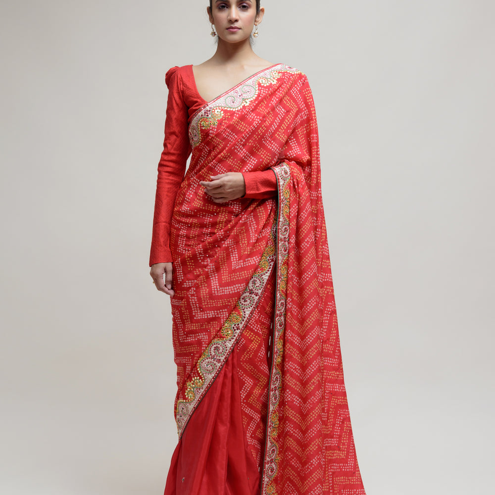 
                      
                        Red Bandhani on Crepe Saree with Mirror Work
                      
                    