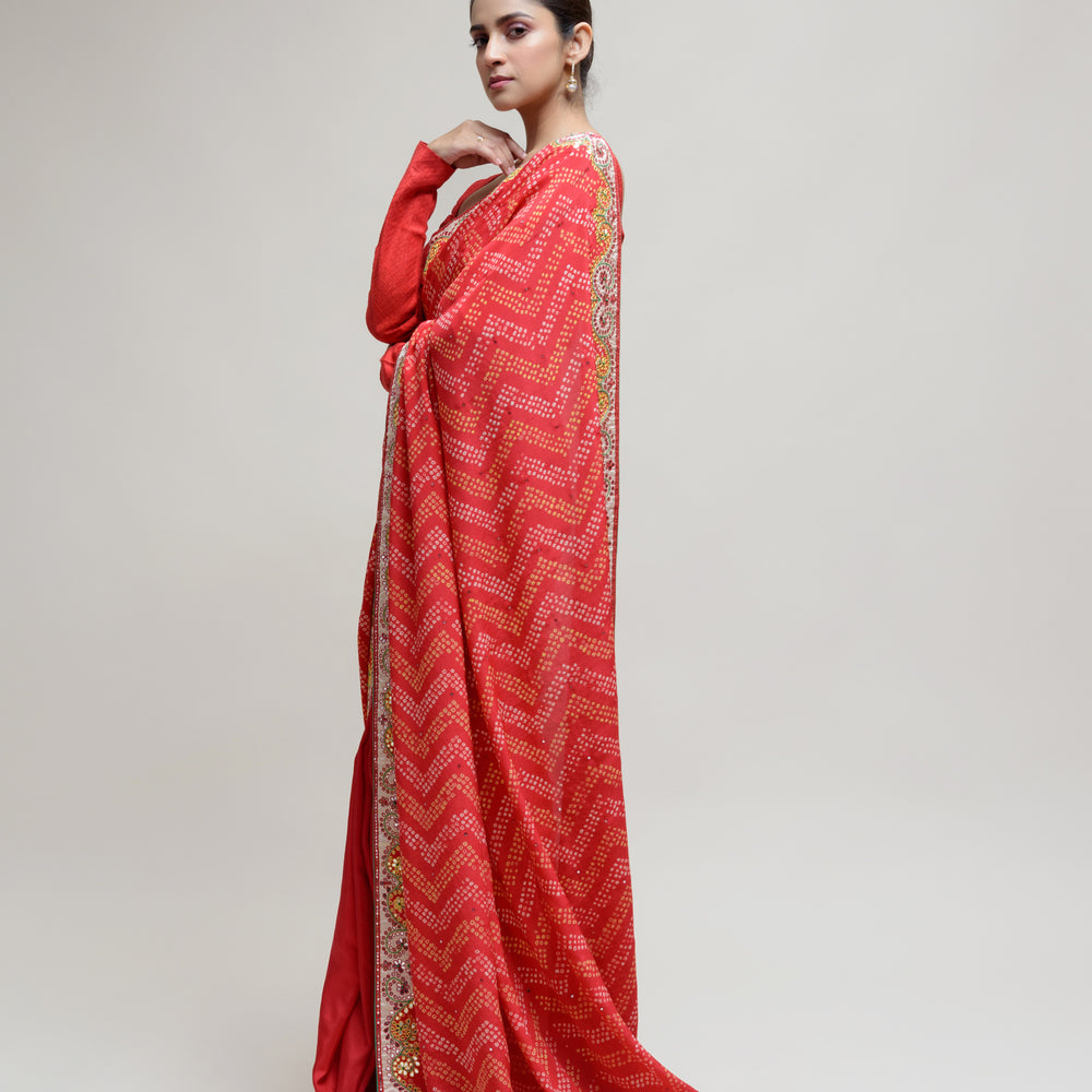 
                      
                        Red Bandhani on Crepe Saree with Mirror Work
                      
                    