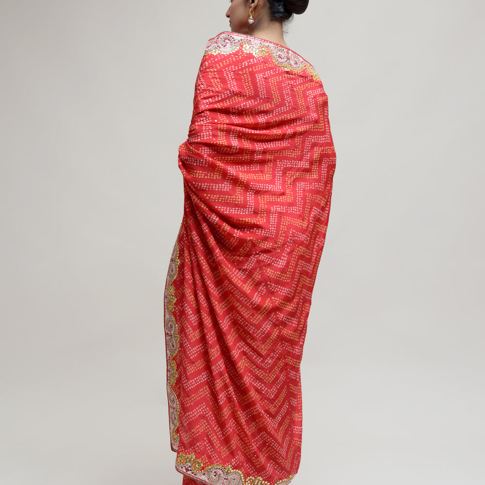 
                      
                        Red Bandhani on Crepe Saree with Mirror Work
                      
                    