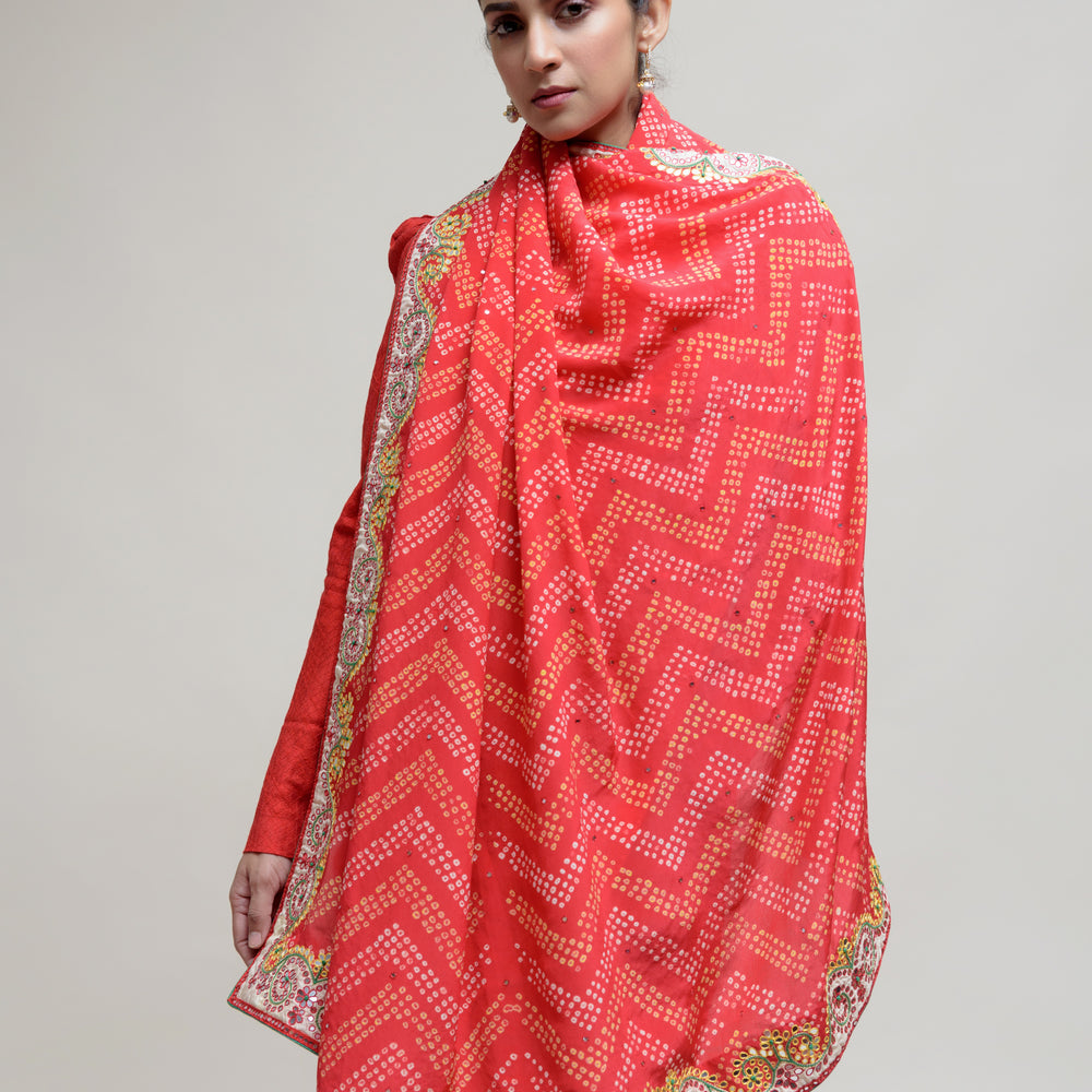 
                      
                        Red Bandhani on Crepe Saree with Mirror Work
                      
                    