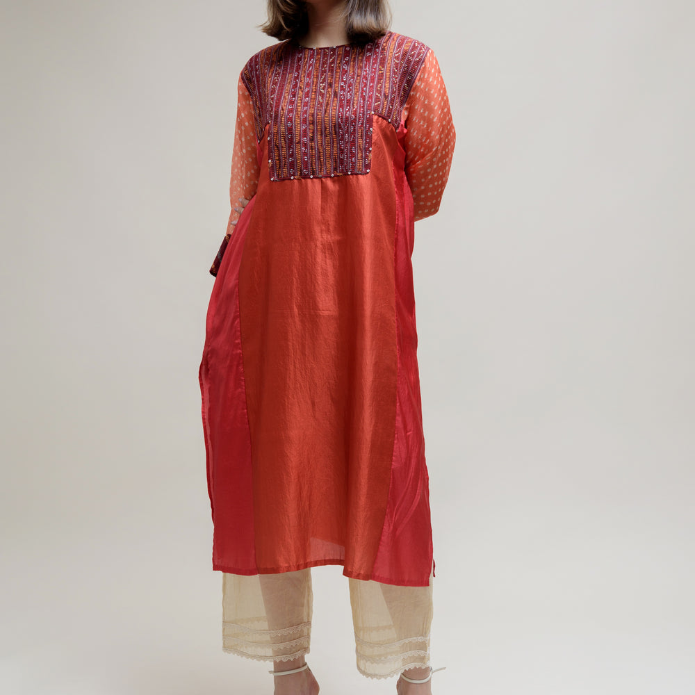 
                      
                        Brick Brown Orange Silk Organza Kurta with a Unique Yoke
                      
                    