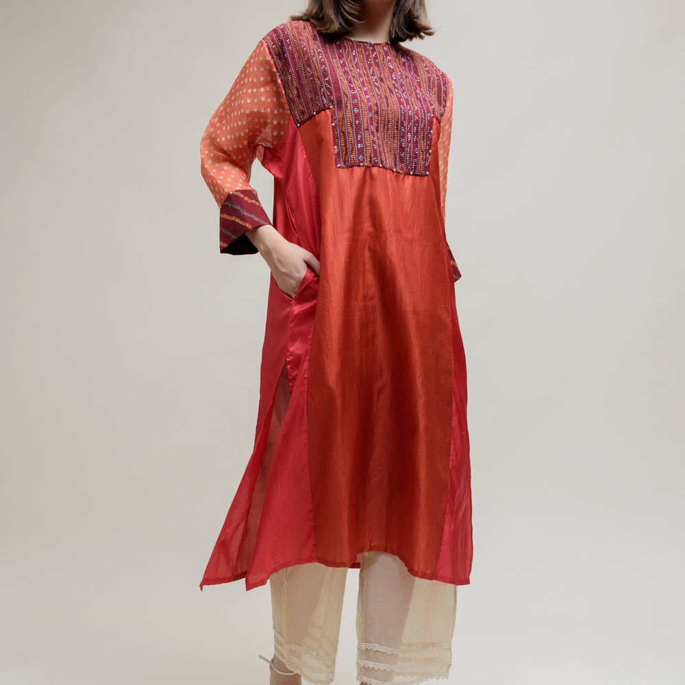 
                      
                        Brick Brown Orange Silk Organza Kurta with a Unique Yoke
                      
                    