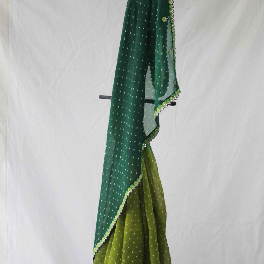 
                      
                        Green Shaded Bandhani on Organza Saree with Gota Patti
                      
                    