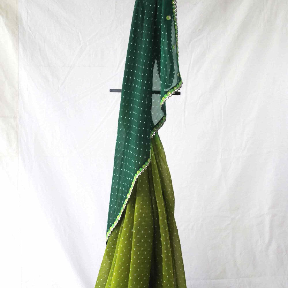 
                      
                        Green Shaded Bandhani on Organza Saree with Gota Patti
                      
                    