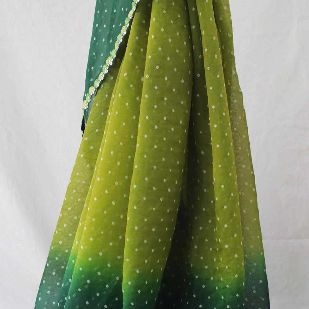 
                      
                        Green Shaded Bandhani on Organza Saree with Gota Patti
                      
                    