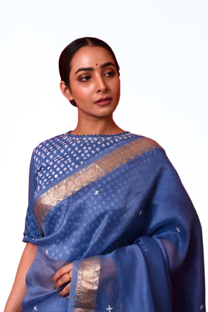 
                      
                        Blue Organza Saree with Bandhej Blouse
                      
                    