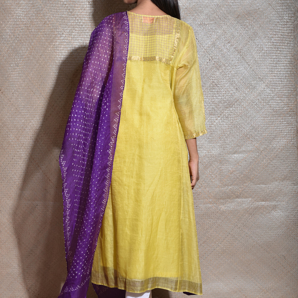 
                      
                        Tissue Chanderi Kurta Set With Bandhani on Organza Dupatta-Lemon Yellow And Purple.
                      
                    