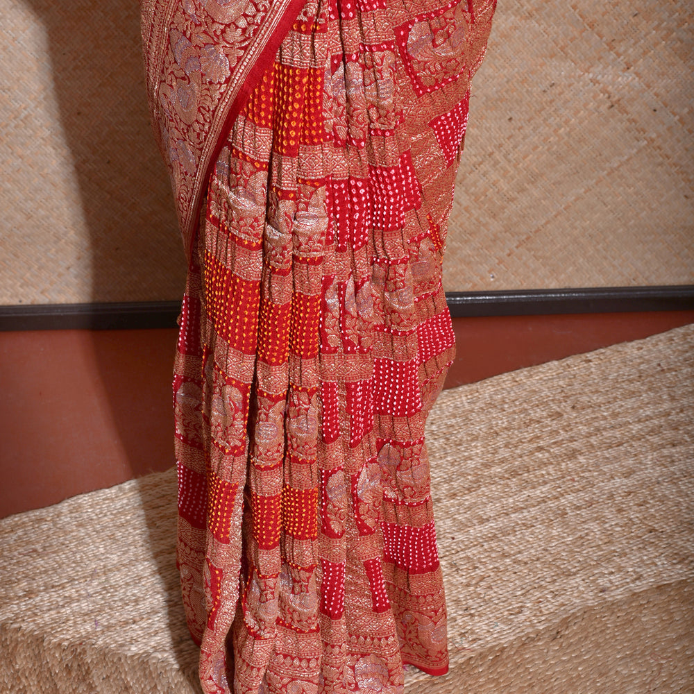 
                      
                        Peacock Border Banarasi Bandhani Gharchola Saree in Red
                      
                    