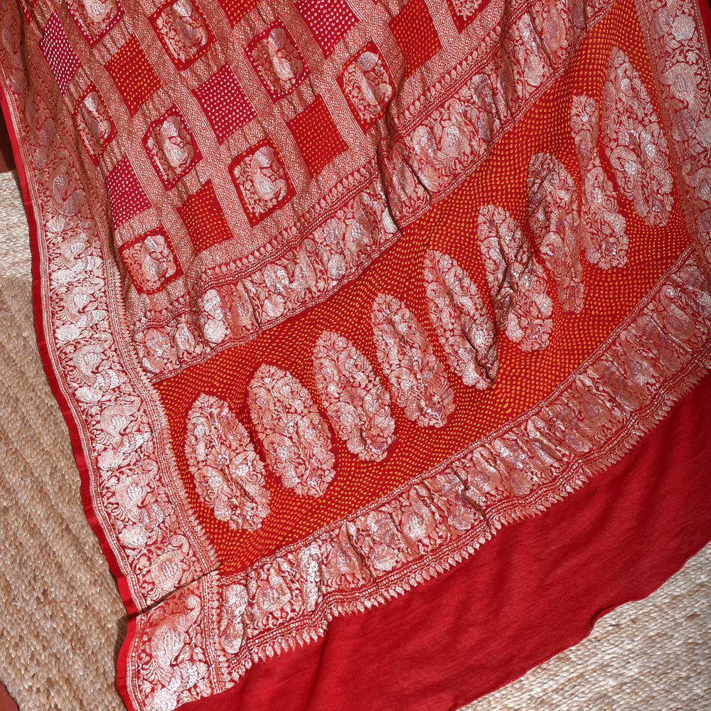 
                      
                        Peacock Border Banarasi Bandhani Gharchola Saree in Red
                      
                    