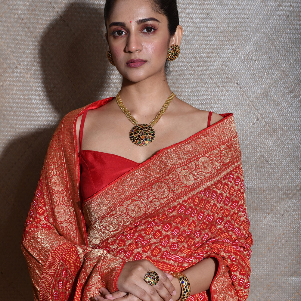 
                      
                        Pure Zari Saree Banarasi Bandhani In Vermilion Red.
                      
                    