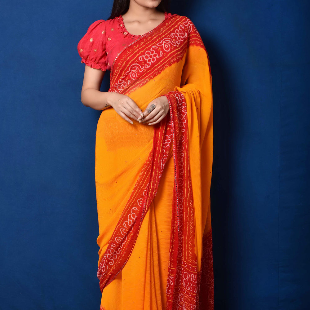 
                      
                        Classic Red and Orange Bandhani Chiffon Saree
                      
                    