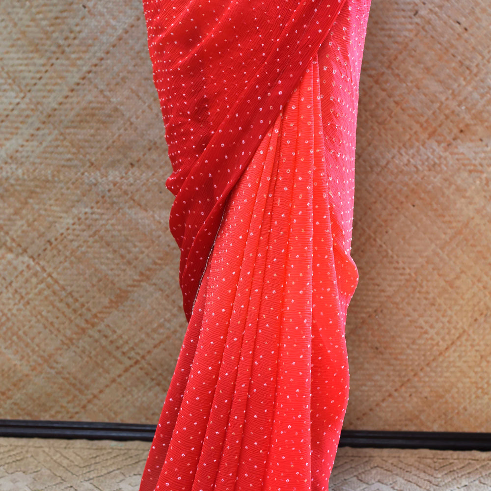 
                      
                        Red Peach Bandhani Saree in Pure Chiffon
                      
                    