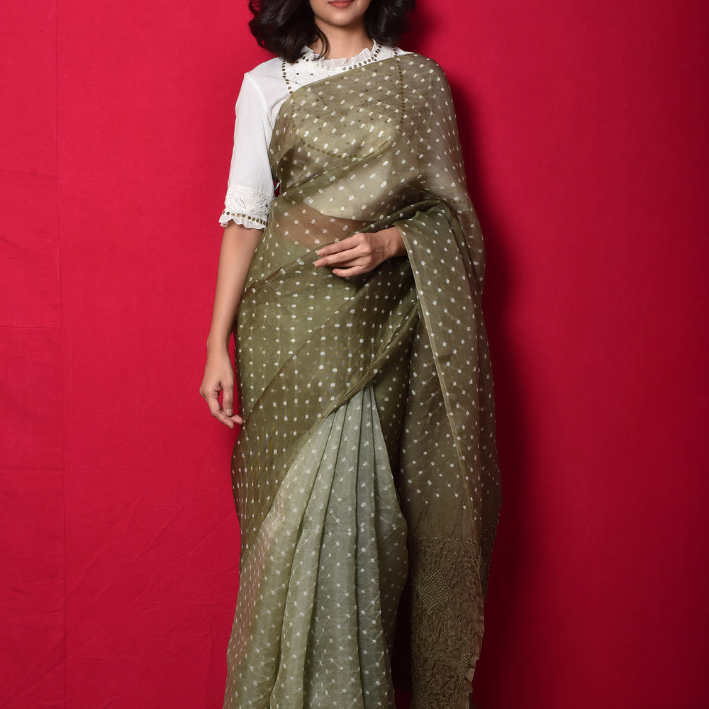 
                      
                        Bandhani on Organza Saree with Pattern on Pallu - Dull Green
                      
                    