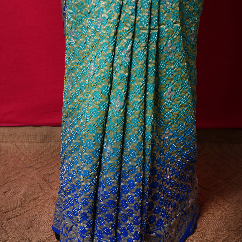 
                      
                        Gharchola Banarasi Bandhani Saree in Shades of Blue
                      
                    