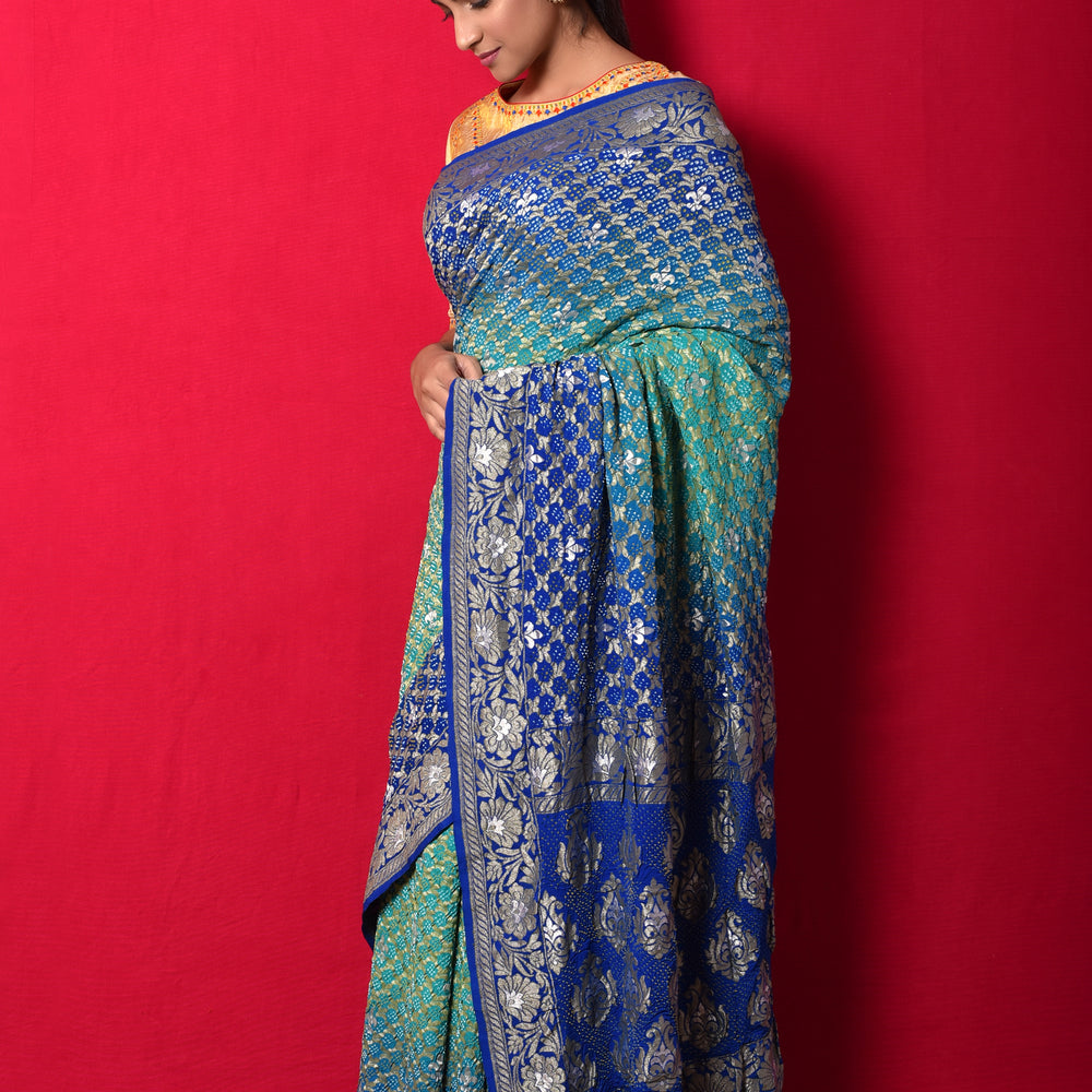 
                      
                        Gharchola Banarasi Bandhani Saree in Shades of Blue
                      
                    