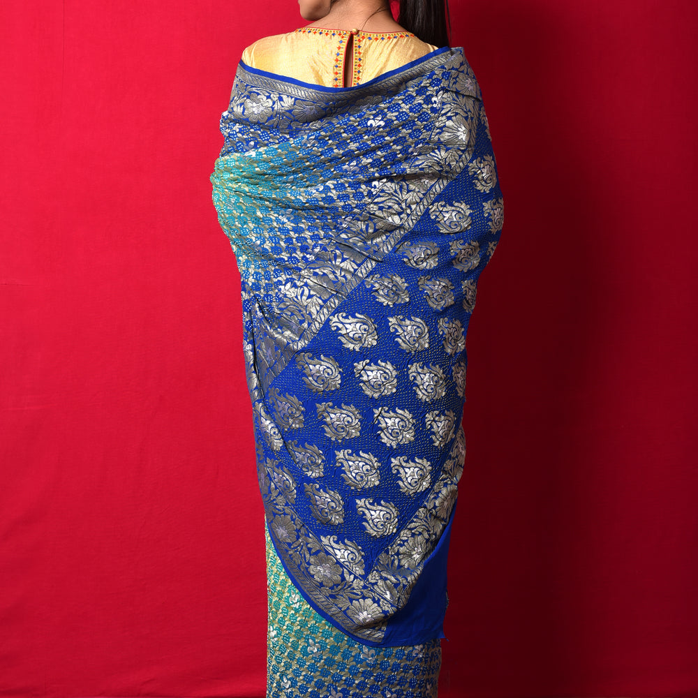 
                      
                        Gharchola Banarasi Bandhani Saree in Shades of Blue
                      
                    