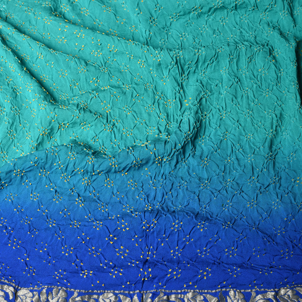 
                      
                        Gharchola Banarasi Bandhani Saree in Shades of Blue
                      
                    