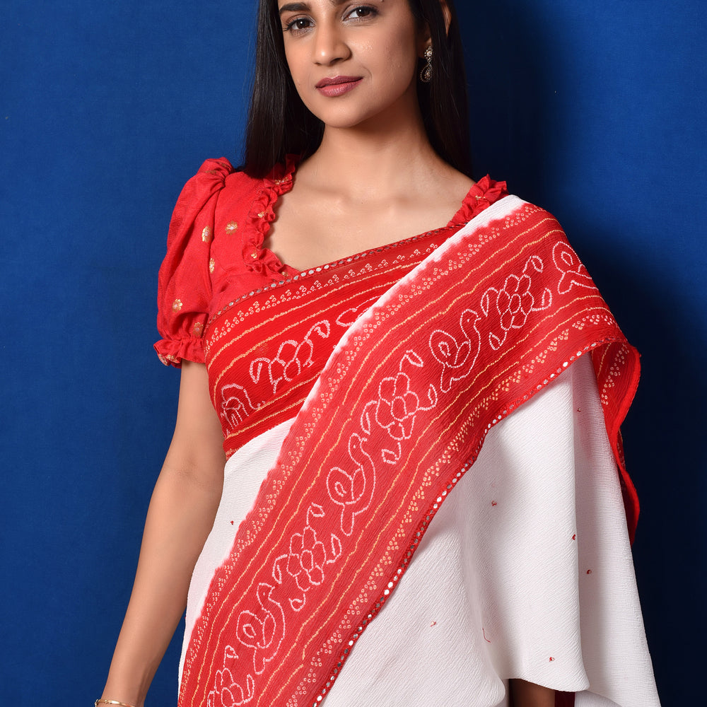 
                      
                        Classic Red and White Bandhani Chiffon Saree
                      
                    