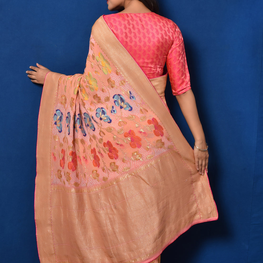 
                      
                        Floral Meenakari Motifs on a Peach Banarasi Bandhani Saree
                      
                    