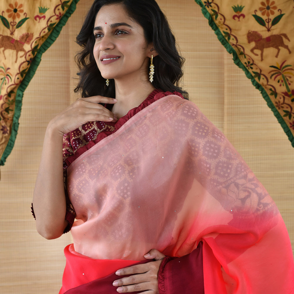 
                      
                        Shaded Organza Saree with Banarasi Bandhani Blouse - Peach to Maroon
                      
                    