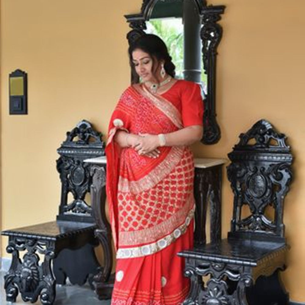 
                      
                        Pure Zari Banarasi Bandhani Saree in a Festive Red
                      
                    